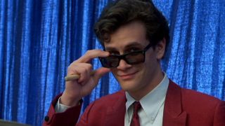 A very happy Tom Everett Scott peeks over his sunglasses in That Thing You Do!