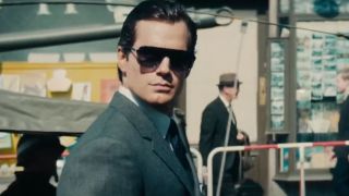 Henry Cavill looking to the side while wearing sunglasses in The Man From UNCLE.