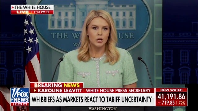 White House press secretary Karoline Leavitt brags that Trump's ‘America First’ policies will boost the economy, all while the Dow Jones sinks in real-time during Fox News' live broadcast of her remarks